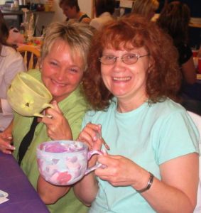 Two Smiling Jumbo Mug Painters at Claytopia Erie PA